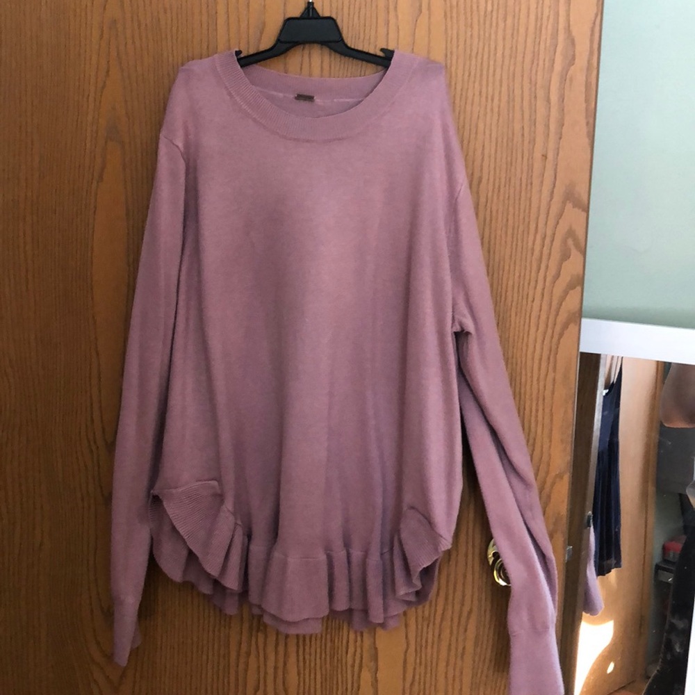 Pink sweater with knit ruffled bottom